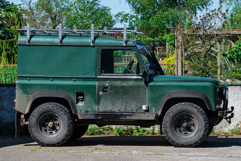 A green Land Rover Defender