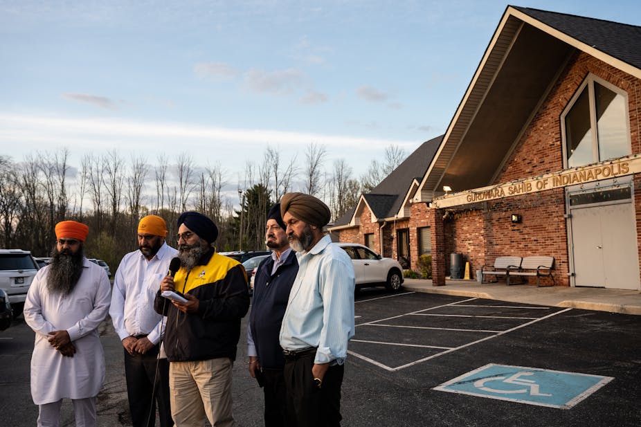 Five leaders of the Sikh community, wearing turbans, standing outside their temple in Indianapolis, Indiana. 