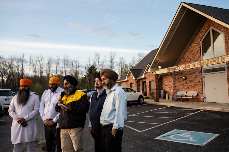 Five leaders of the Sikh community, wearing turbans, standing outside their temple in Indianapolis, Indiana.