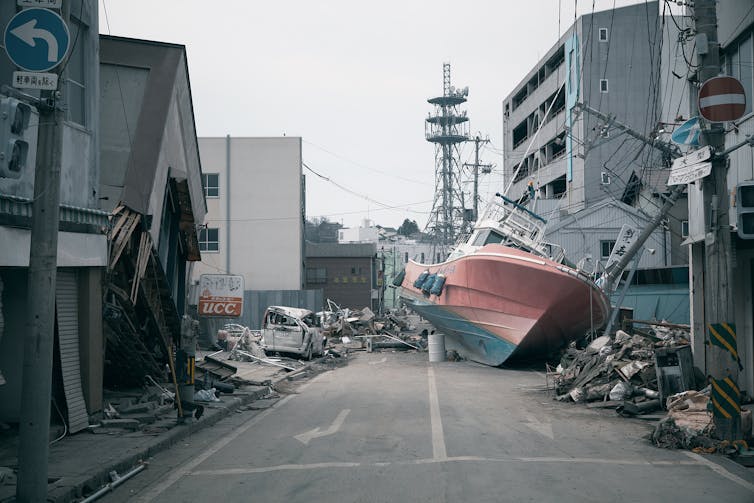 Ship washed up on street after Japanese tsunami