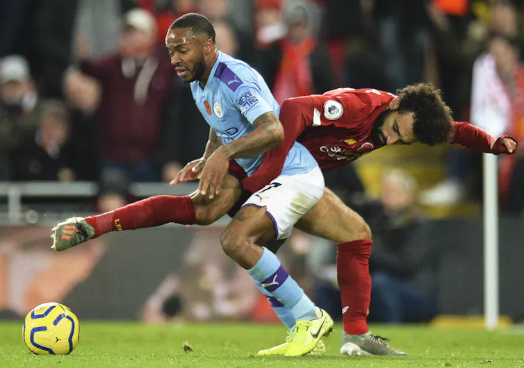 Mohamed Salah of Liverpool taking on Manchester City's Raheem Sterling in 2019.