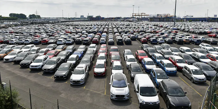 hundreds of cars parked in a lot
