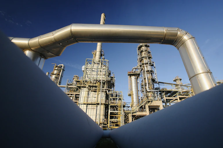 A pipeline beside an oil refinery