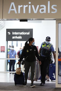 Border workers in the arrival hall.