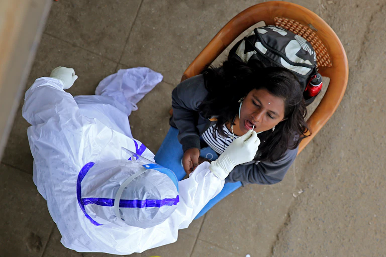 A woman getting tested for coronavirus in India