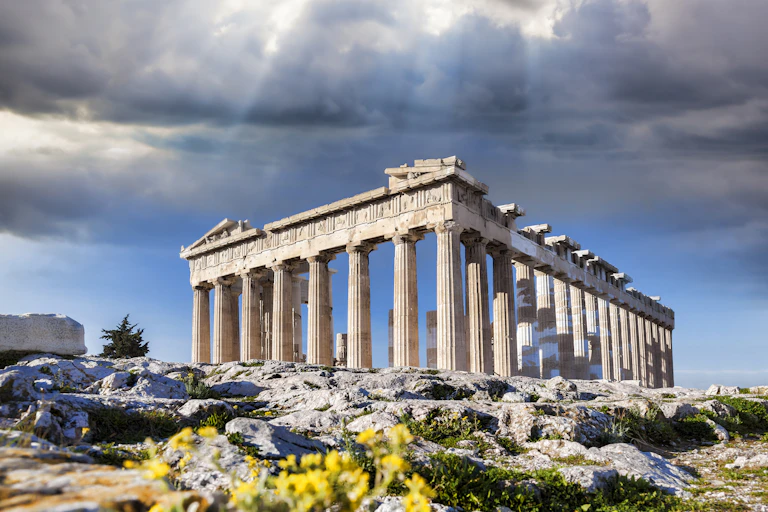 Ancient Greek building against sky backdrop.