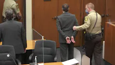 A handcuffed Derek Chauvin is escorted from the courtroom.