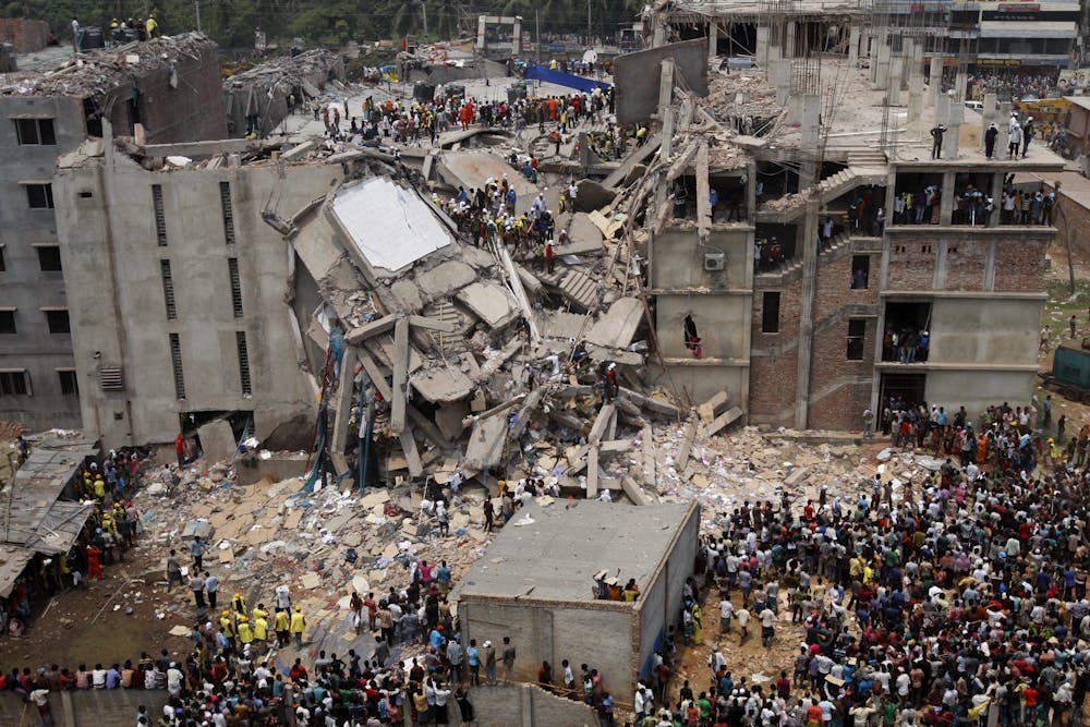 Rescue workers search for survivors in the ruins of the collapsed Rana Plaza building on April 25 2013. Abir Abdullah/EPA