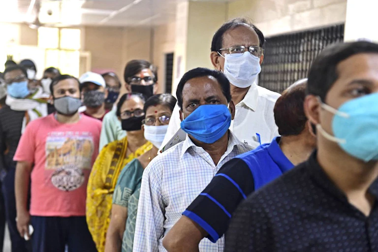 People in India waiting to be vaccinated.
