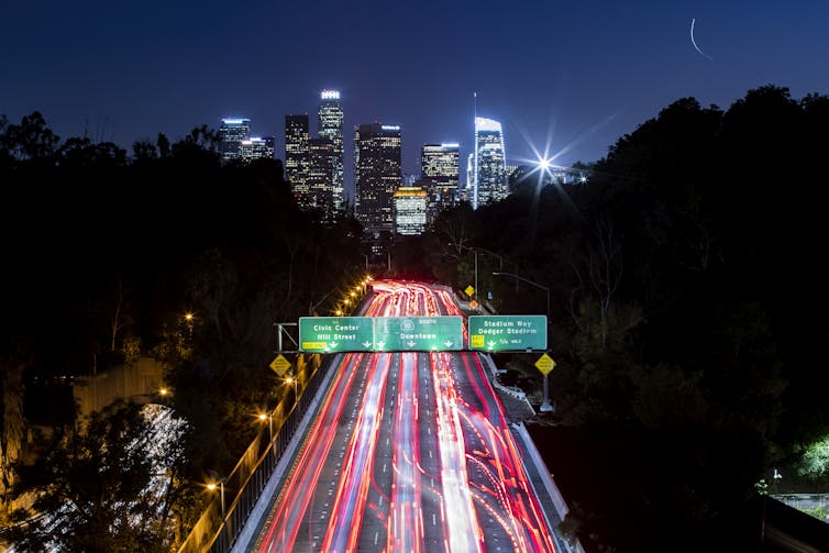 A long exposure image of a motorway in California at night.