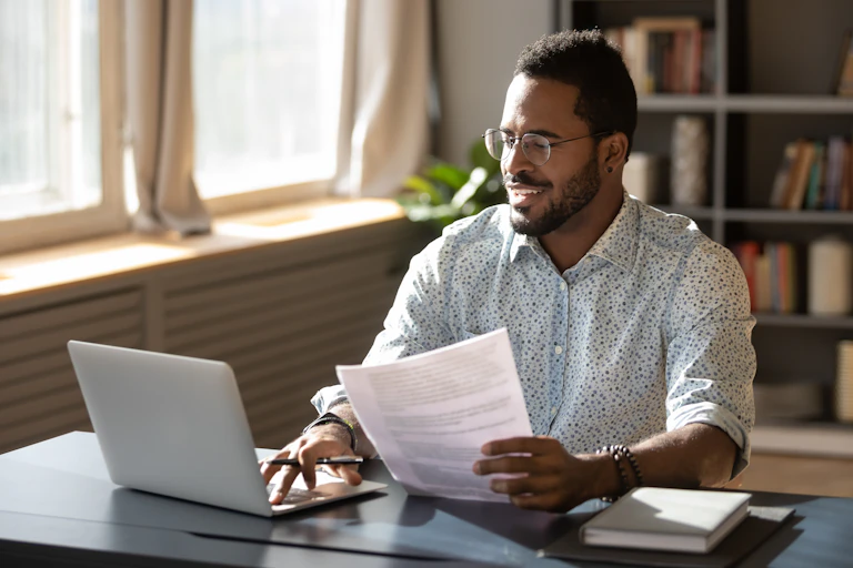 Man sits at computer filling out form