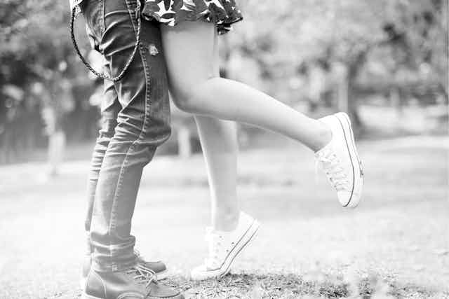 Legs of young couple.