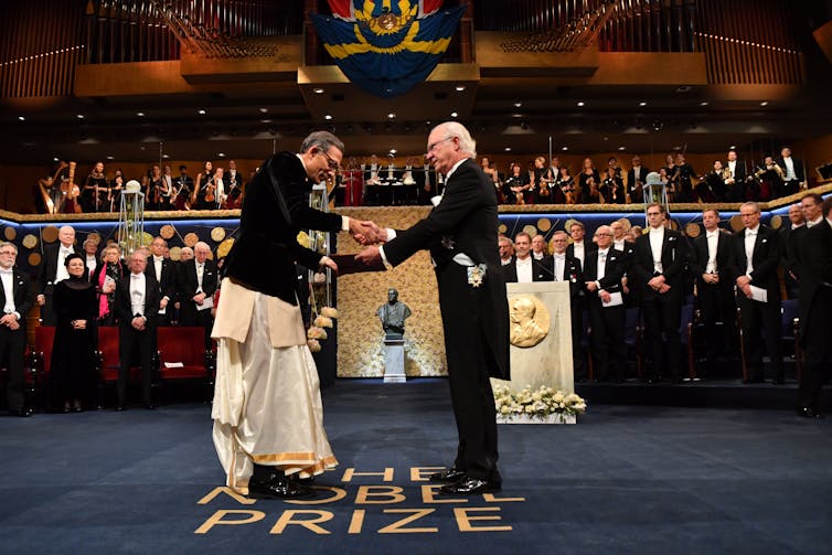 Economist Abhijit Banerjee receives the Sveriges Riksbank Prize in Economic Sciences in Memory of Alfred Nobel from King Carl XVI Gustaf of Sweden in Stockholm on December 10 2019.