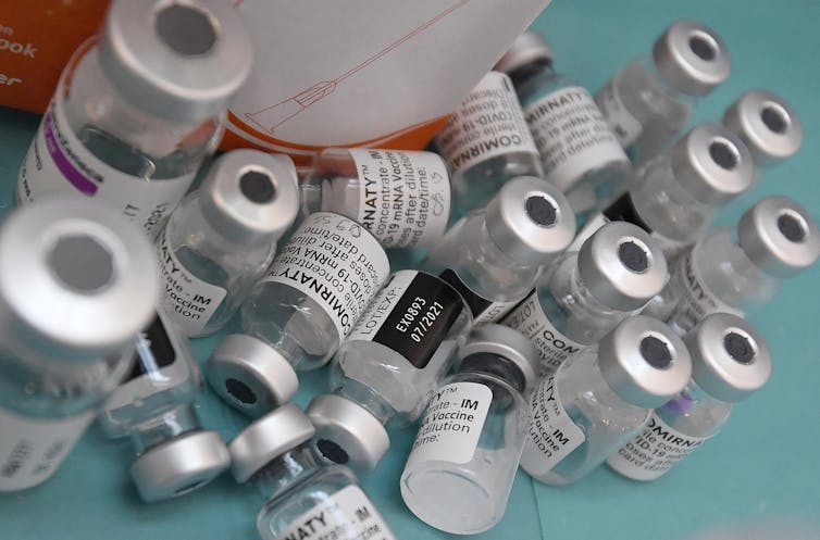 Empty vials of various different COVID-19 vaccines after use