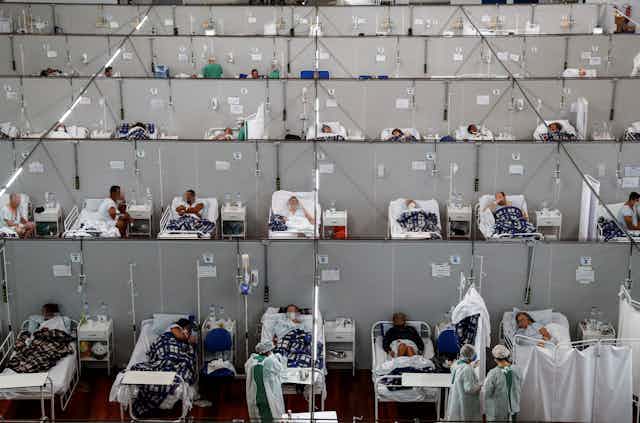 Dozens of patients in hospital beds in a temporary COVID ward in Brazil. 