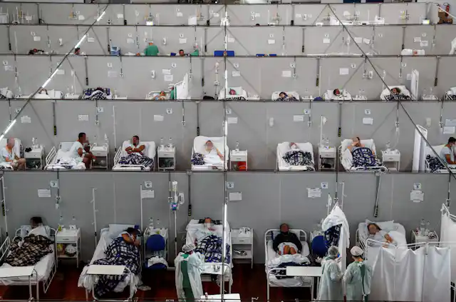 Dozens of patients in hospital beds in a temporary COVID ward in Brazil.