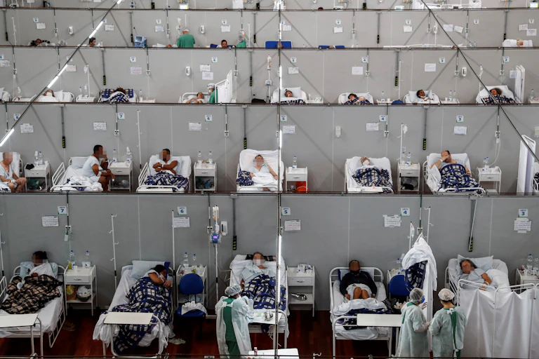 Dozens of patients in hospital beds in a temporary COVID ward in Brazil.