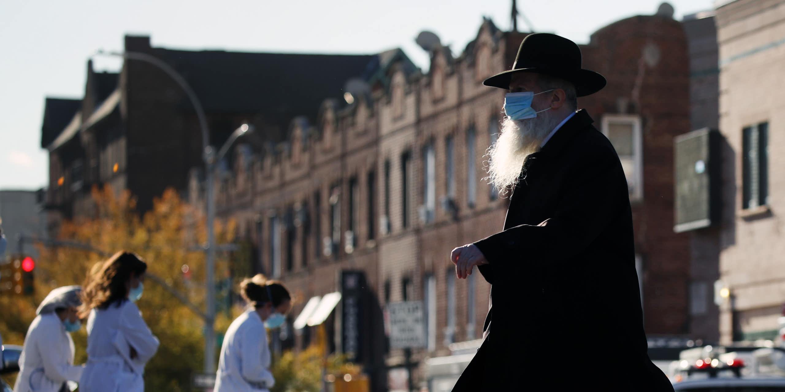 Hasidic man crosses the street in New York City
