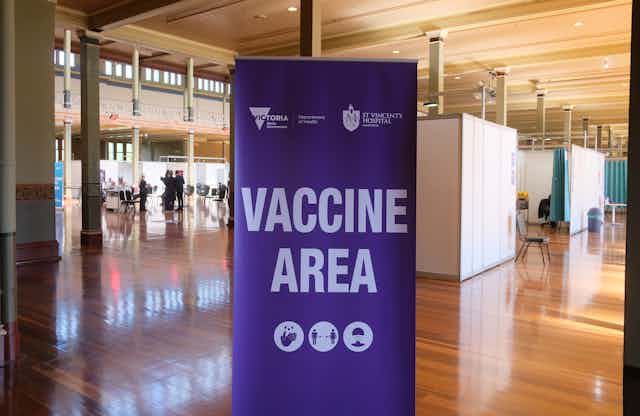 A sign saying 'vaccine area' at the mass vaccination hub at the Royal Exhibition Building in Melbourne