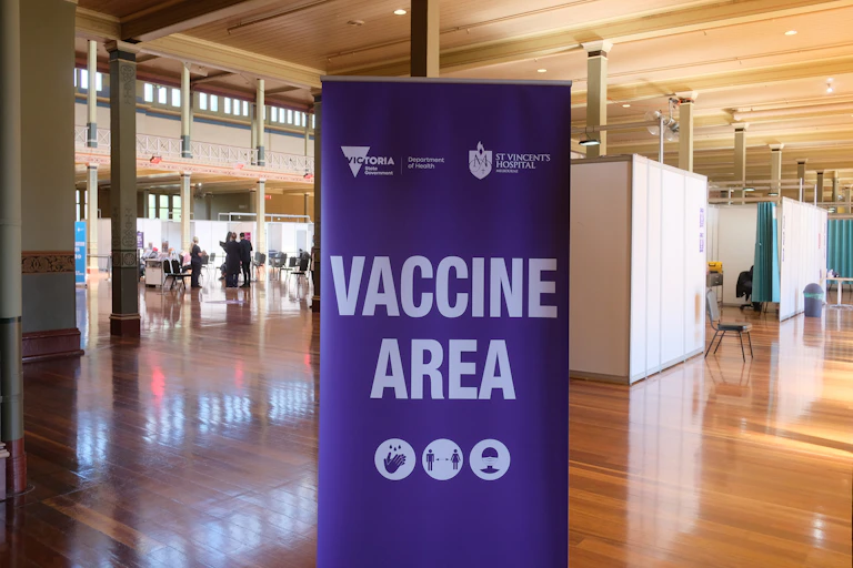 A sign saying 'vaccine area' at the mass vaccination hub at the Royal Exhibition Building in Melbourne