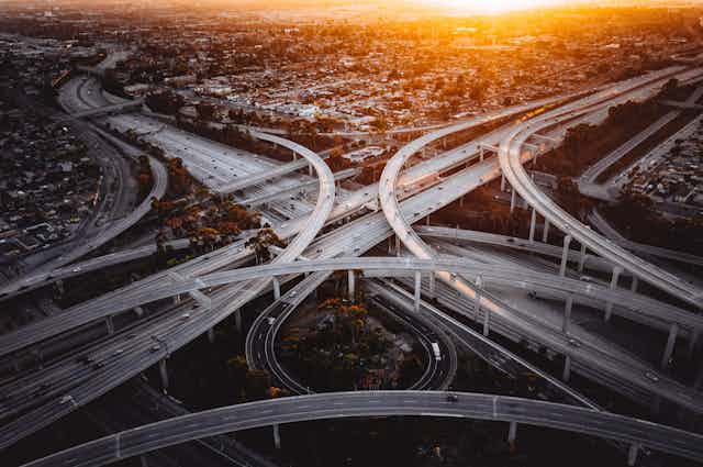 aerial view of overlapping flyovers at freeway interchange