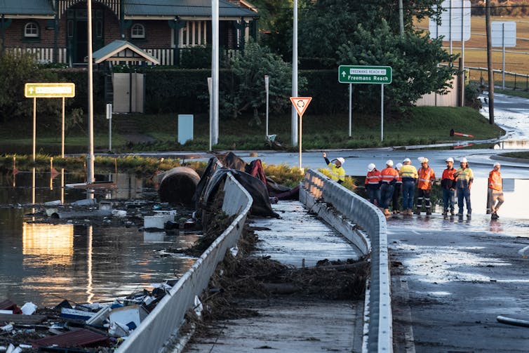 Debris washed up against bridge