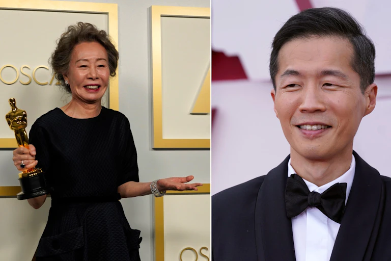 A woman holding an Oscar and a man smiling.