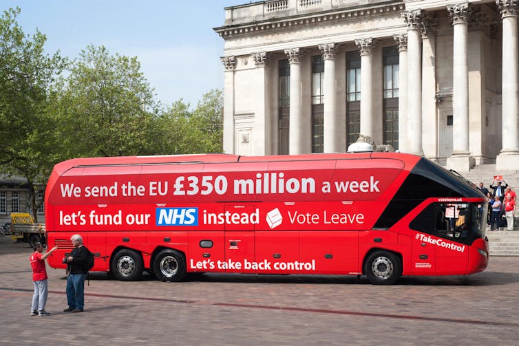 A single-decker red London bus with the slogan: 'We send the EU £350 million a week. Let's fund the NHS instead. Vote Leave'