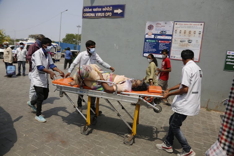 Woman on stretcher.