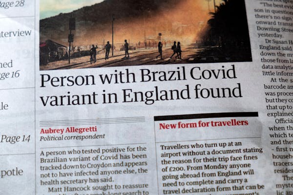 Headline in a newspaper saying a person with the Brazil COVID variant has been found in England.