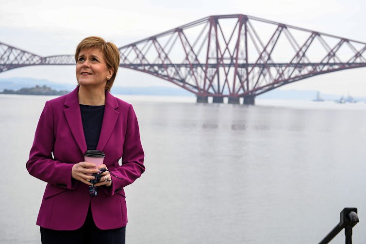 Nicola Sturgeon next to the Forth Bridge