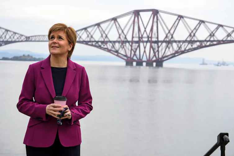 Nicola Sturgeon next to the Forth Bridge