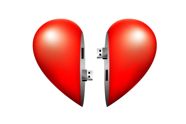 Two halves of a heart connected via USB