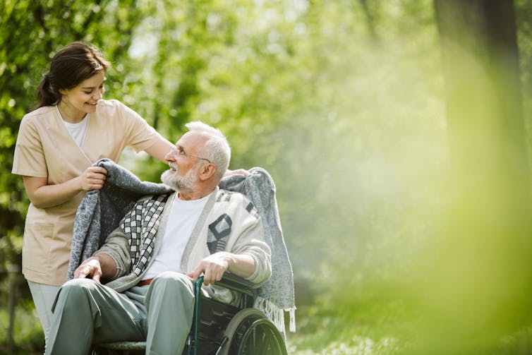 Picture of an elderly man with a nurse.