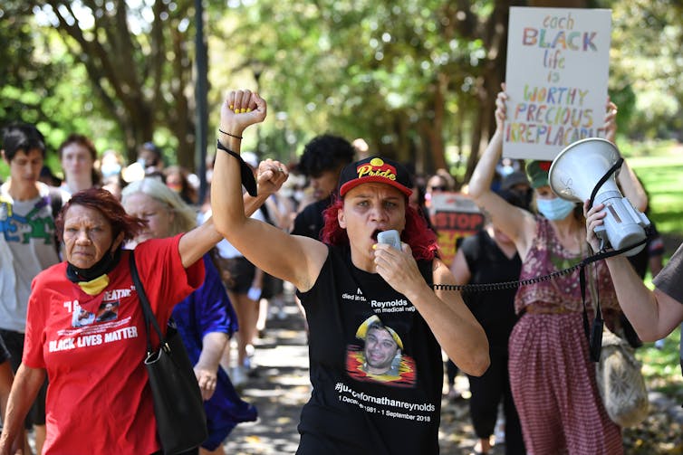 Protestors march during a Black Lives Matter rally in Sydney, Monday, December 7, 2020