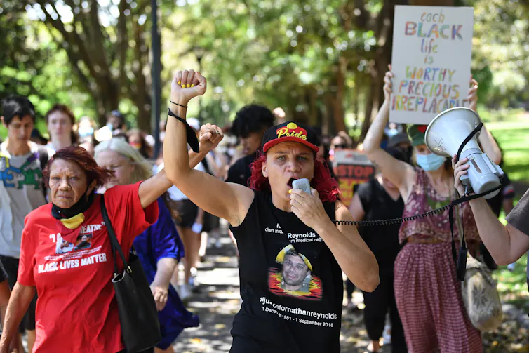 Protestors march during a Black Lives Matter rally in Sydney, Monday, December 7, 2020