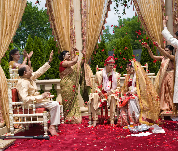 Family celebrates during Indian outdoor wedding