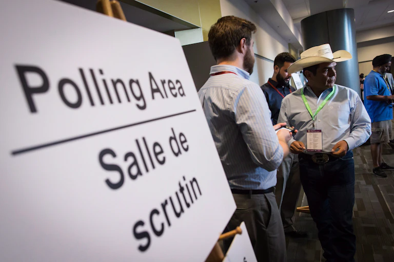 People stand outside polling area