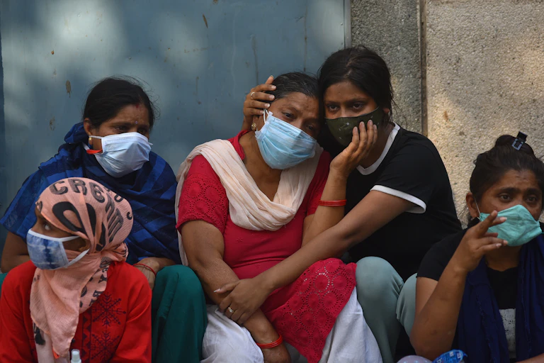 An Indian family, wearing masks