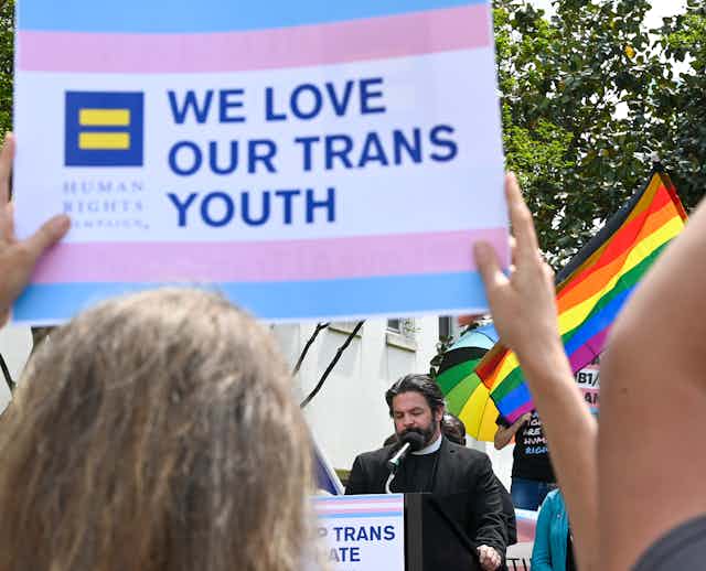 "We love our Trans Youth" sign held aloft at a rally to protest anti-transgender legislation introduced in Alabama.