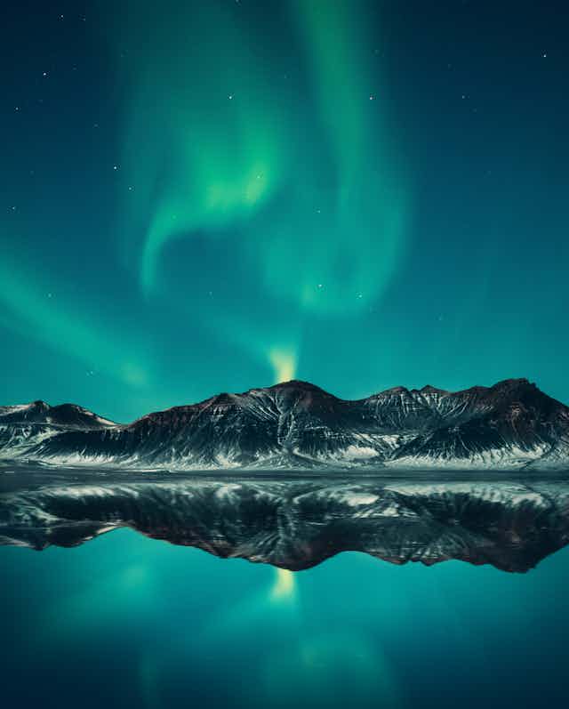 The northern lights over mountains
