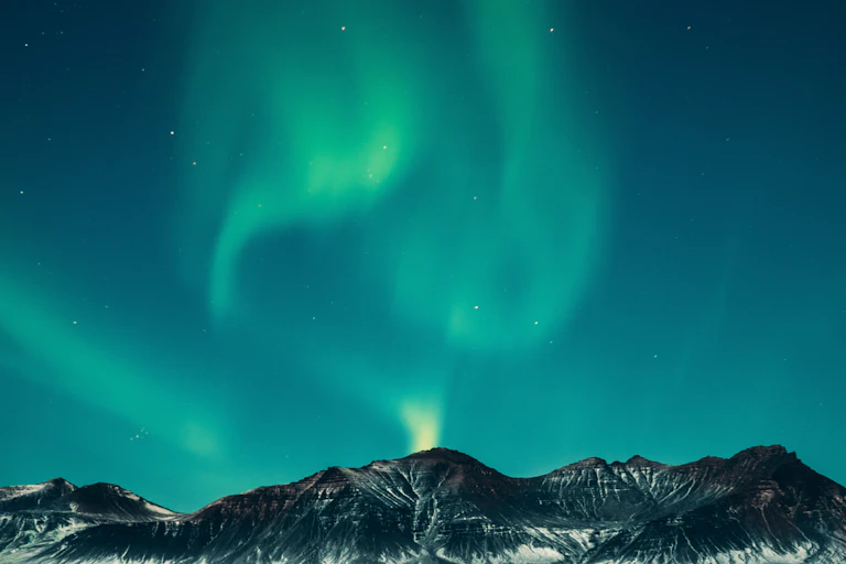 The northern lights over mountains