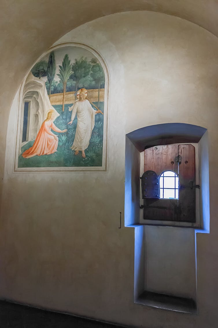 Religious fresco and doorway in old building