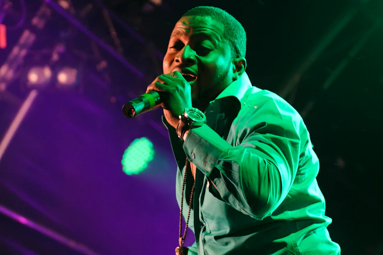 A man singing with a microphone.