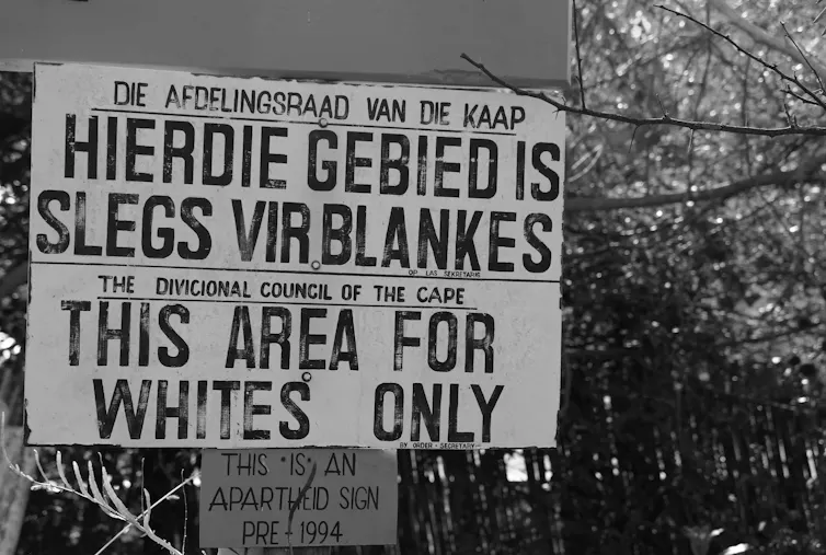 A pre-1994 'apartheid' sign stating in Afrikaans and English that the area is restricted to white people only.
