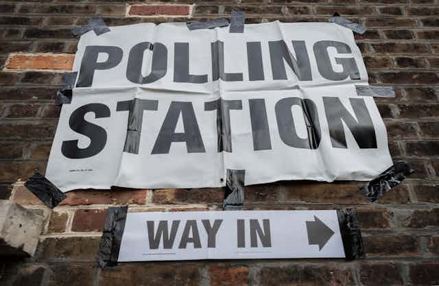 A sign for a polling station.