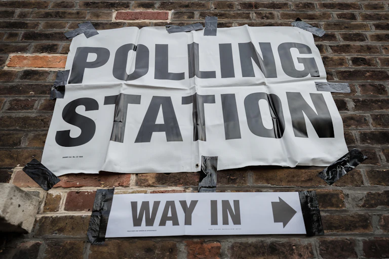 A sign for a polling station.