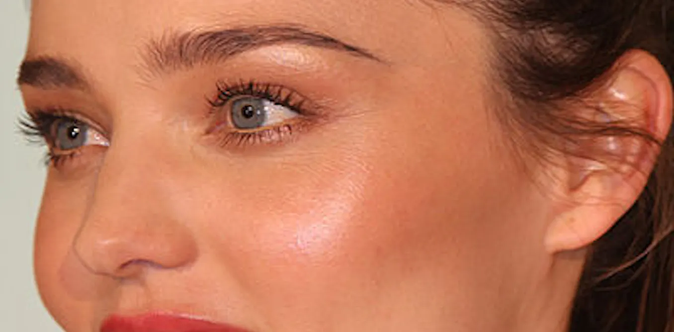 Why the masculine face? Genetic evidence reveals drawbacks of hyper ...