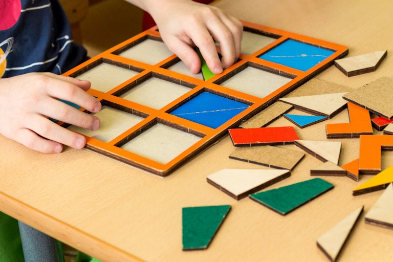 Child playing with shapes