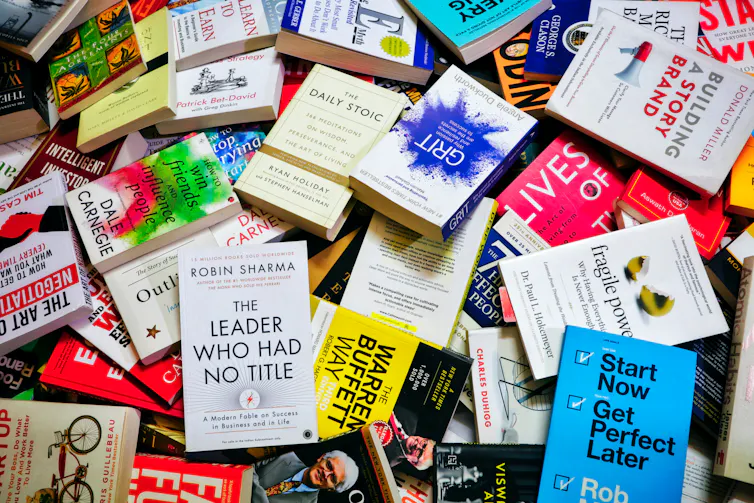 A messy pile of self-help books.